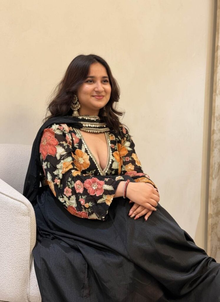 Close-up of Neelam wearing the Alaya Noor Signature Black Floral Anarkali with intricate floral embroidery and choker dupatta from Alaya by Stage3.