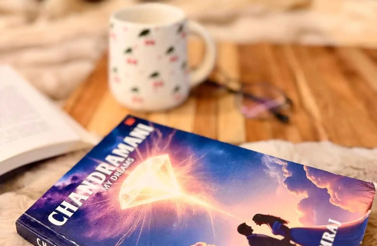 Chandramani My Dreams book by Siva Samraj placed on a cozy reading setup with a coffee mug, symbolising a reflective historical fiction reading experience